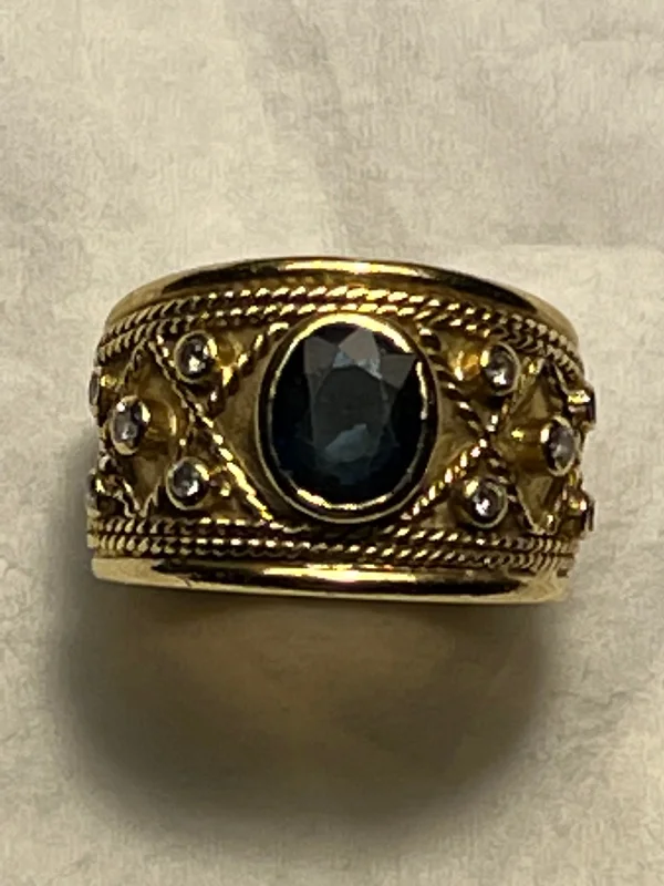 ladies-platinum-narrow-band-rings-Repair - Ring - Blue Sapphire and Diamond