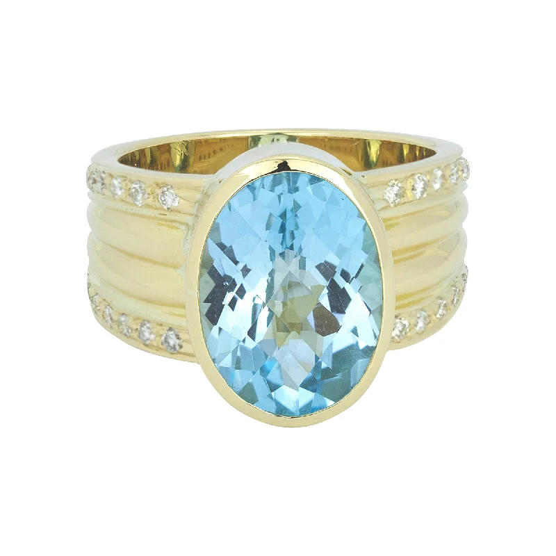 ladies-white-gold-twist-rings-Ring - Blue Topaz And Diamond